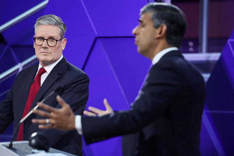 Keir Starmer looks at Rishi Sunak as he answers a question during their final debate.