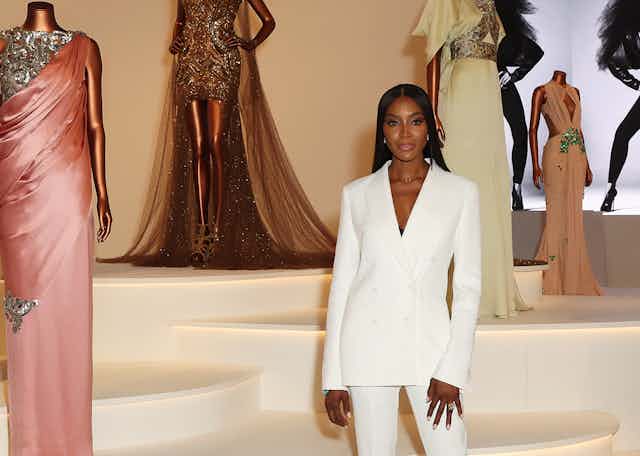 Naomi Campbell in a white suit