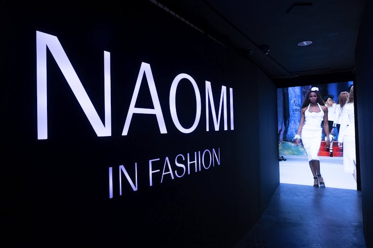 Naomi In Fashion stands tall