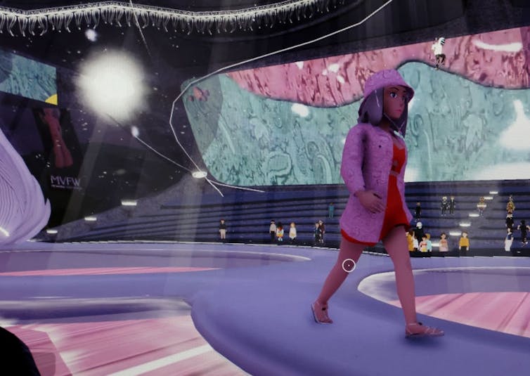A digitally rendered woman in a pink outfit strolls down a catwalk.