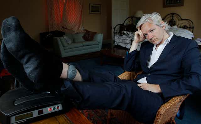 Julian Assange is seen with his ankle security tag at a house in England