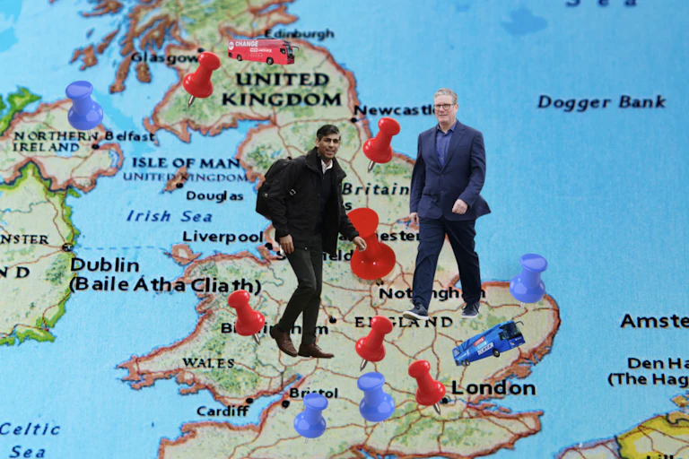 Rishi Sunak and Keir Starmer walk across a map of the UK with blue and red pins in it.