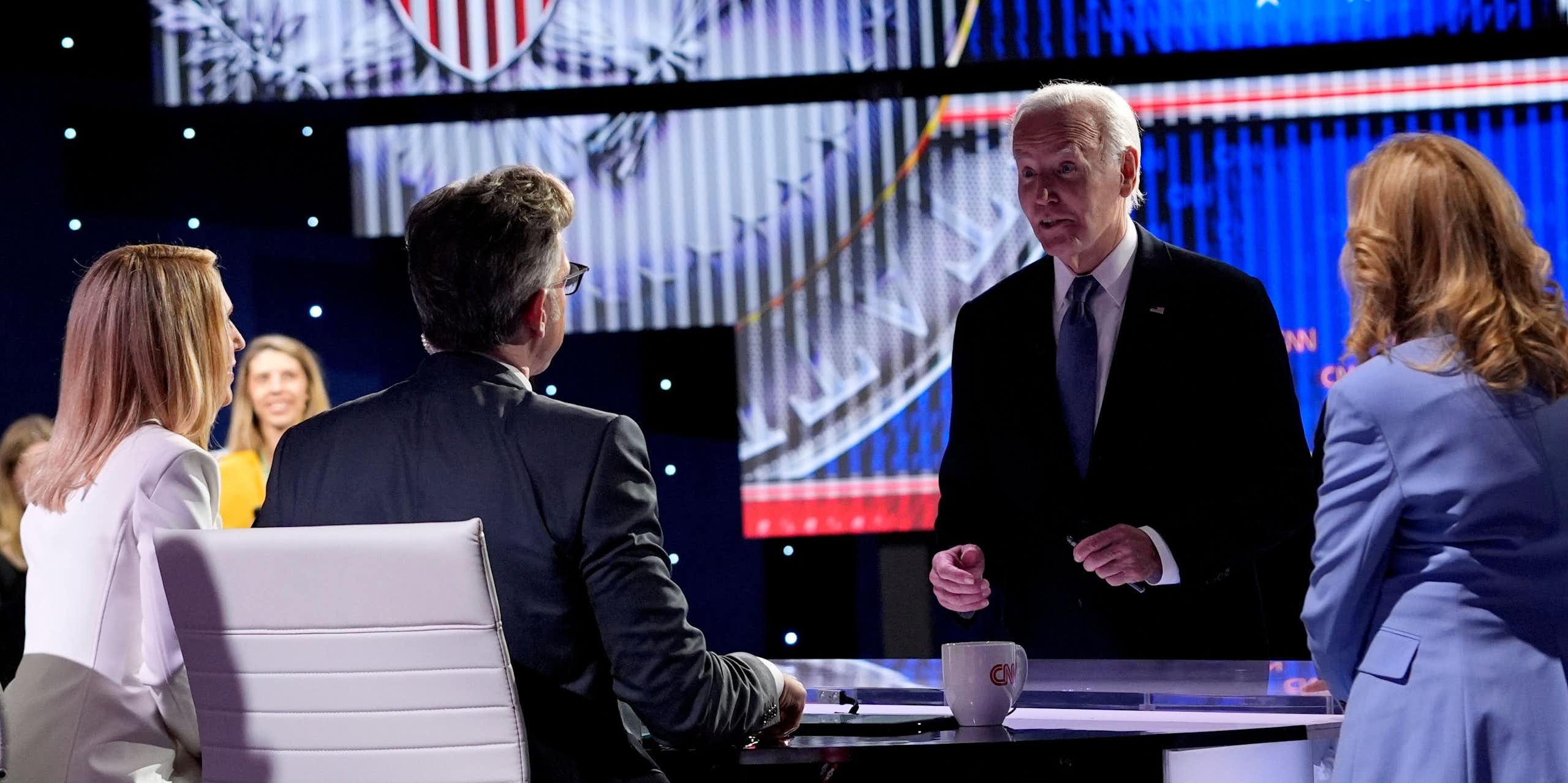 Joe Biden speaks to the host at the TV debate where he clashed with Donald Trump.