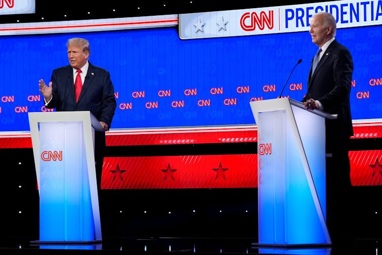 President Joe Biden, right, and Republican presidential candidate former president Donald Trump, left, at podiums during a presidential debate hosted by CNN.