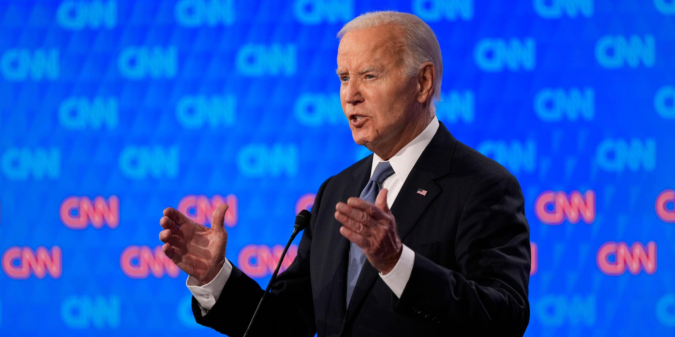 Joe Biden in front of a microphone.