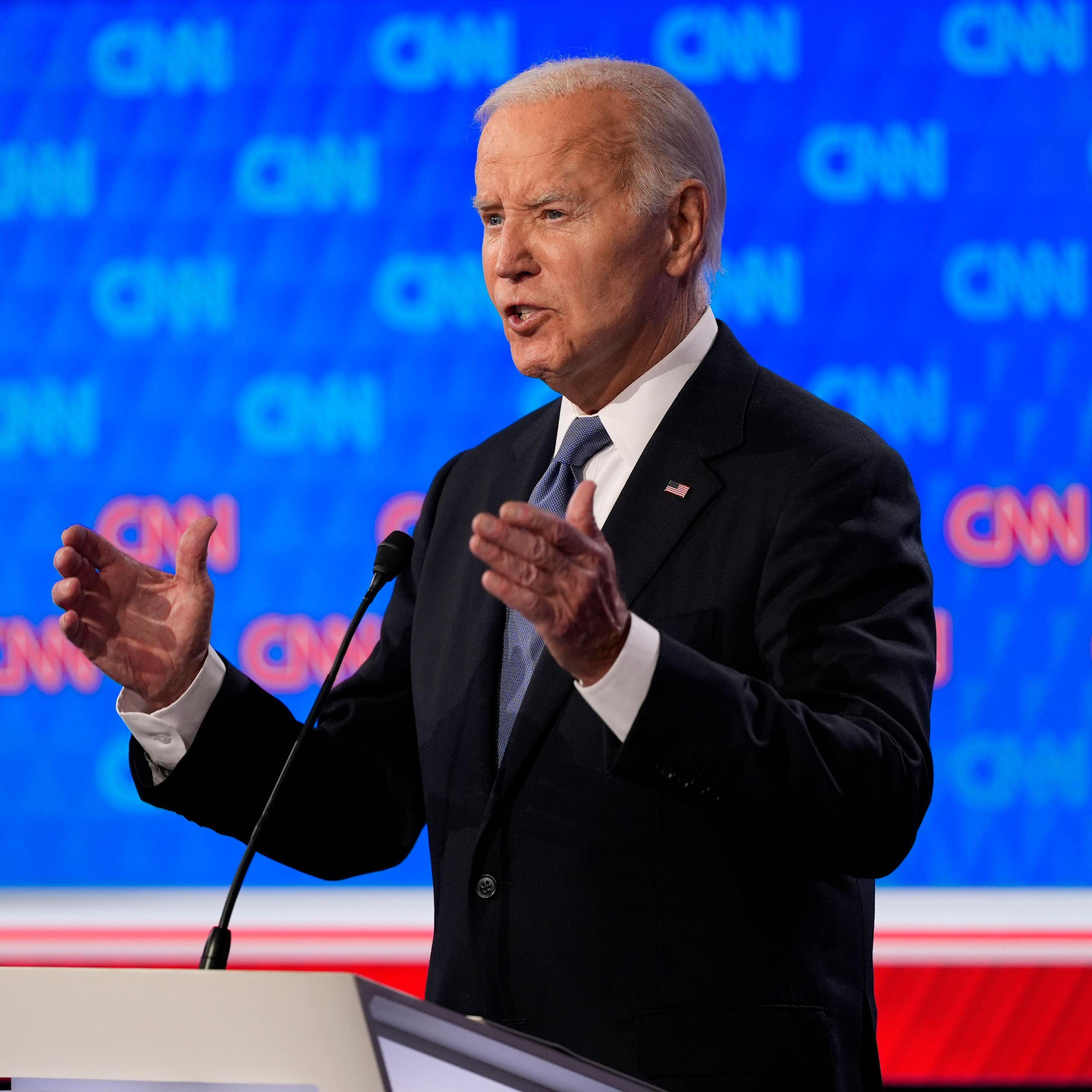Joe Biden in front of a microphone.