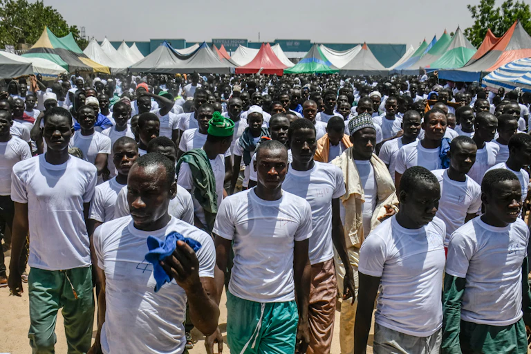 A group of men wearing white shirts