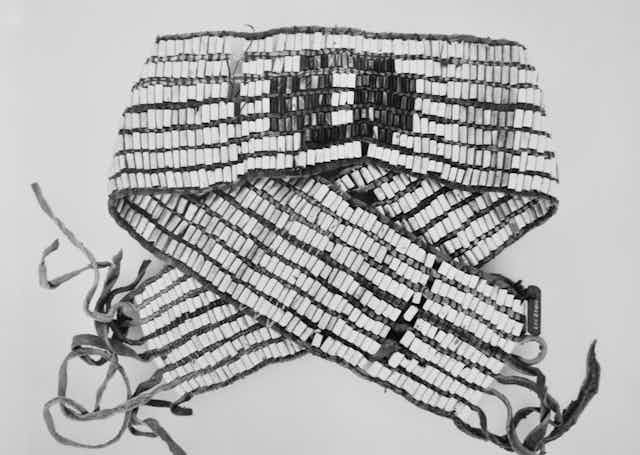  A belt woven with six rows of bead. 