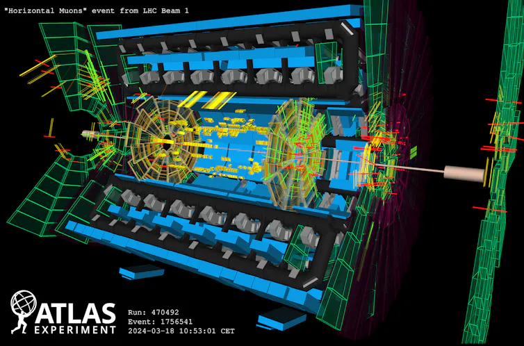 A visualization of the tile calorimeter, with red lines passing through green wheels and yellow panels.