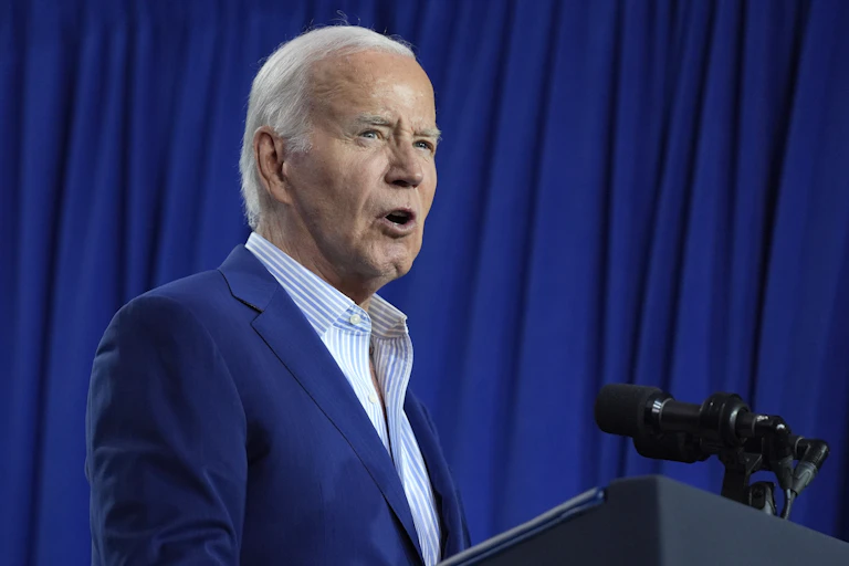 Joe Biden speaks at a lectern