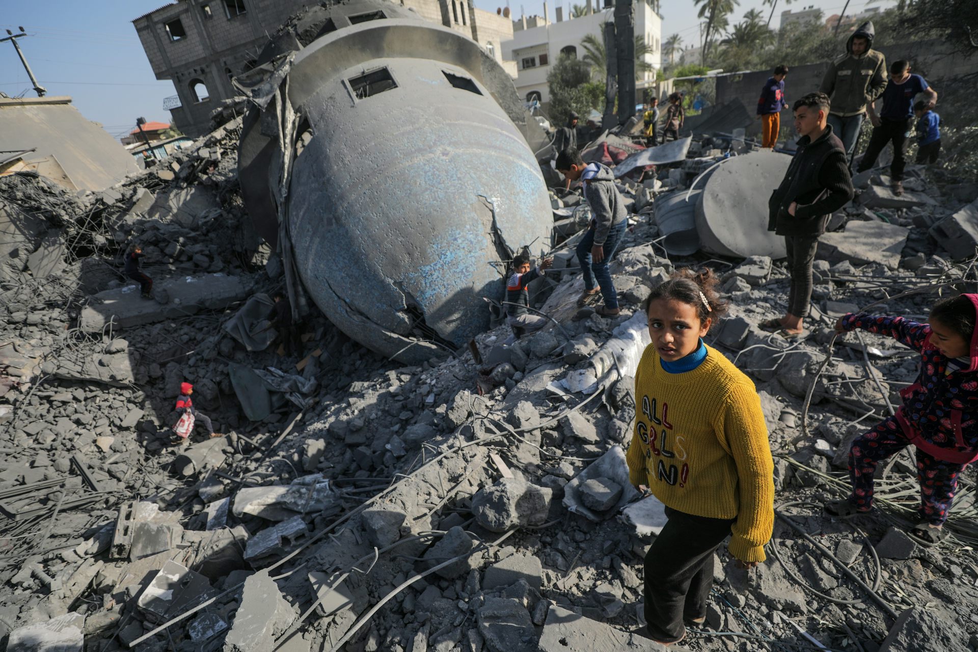 Palestinians inspect a destroyed mosque in Gaza.