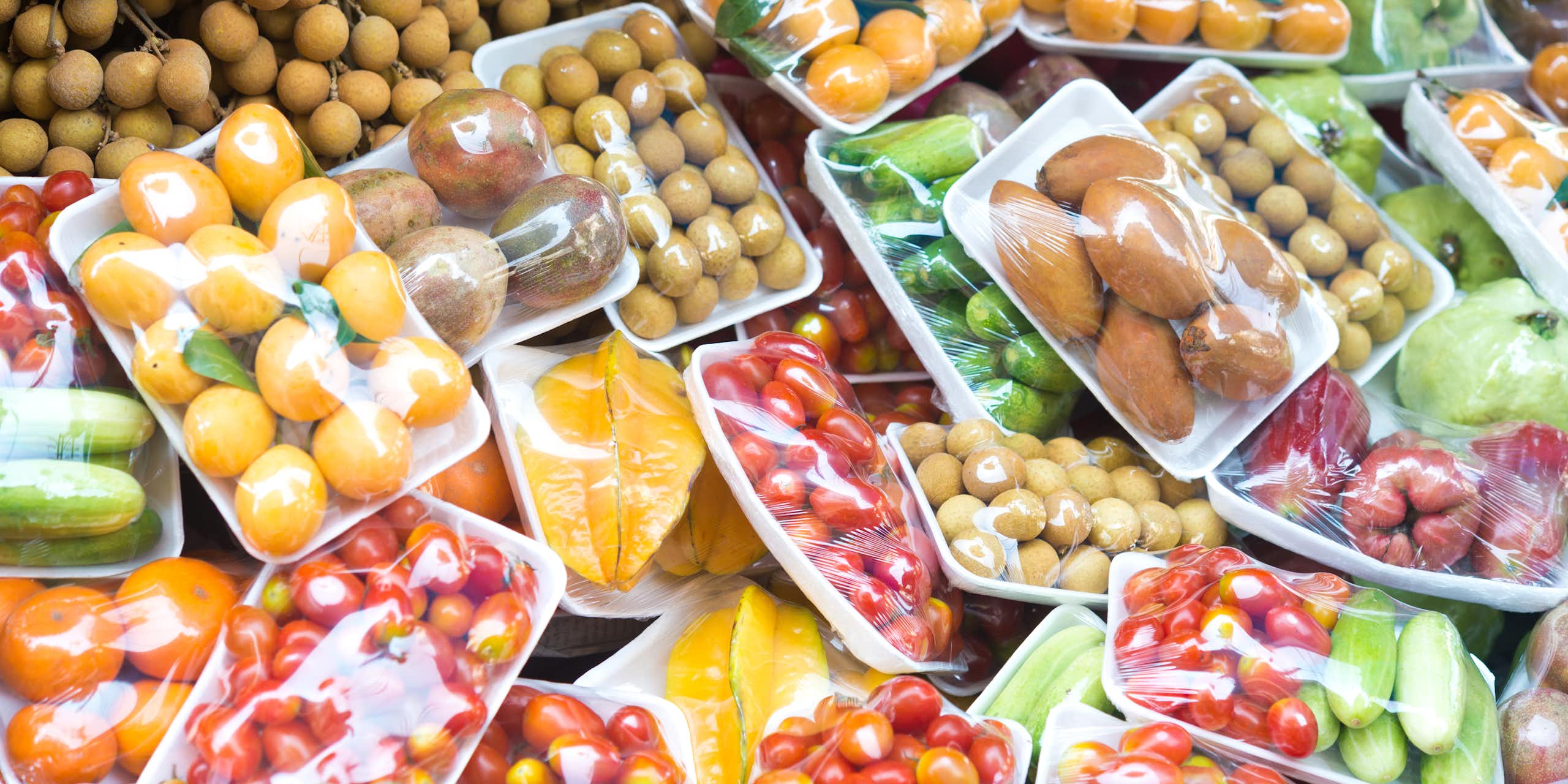 A variety of fruits and vegetables in plastic packing