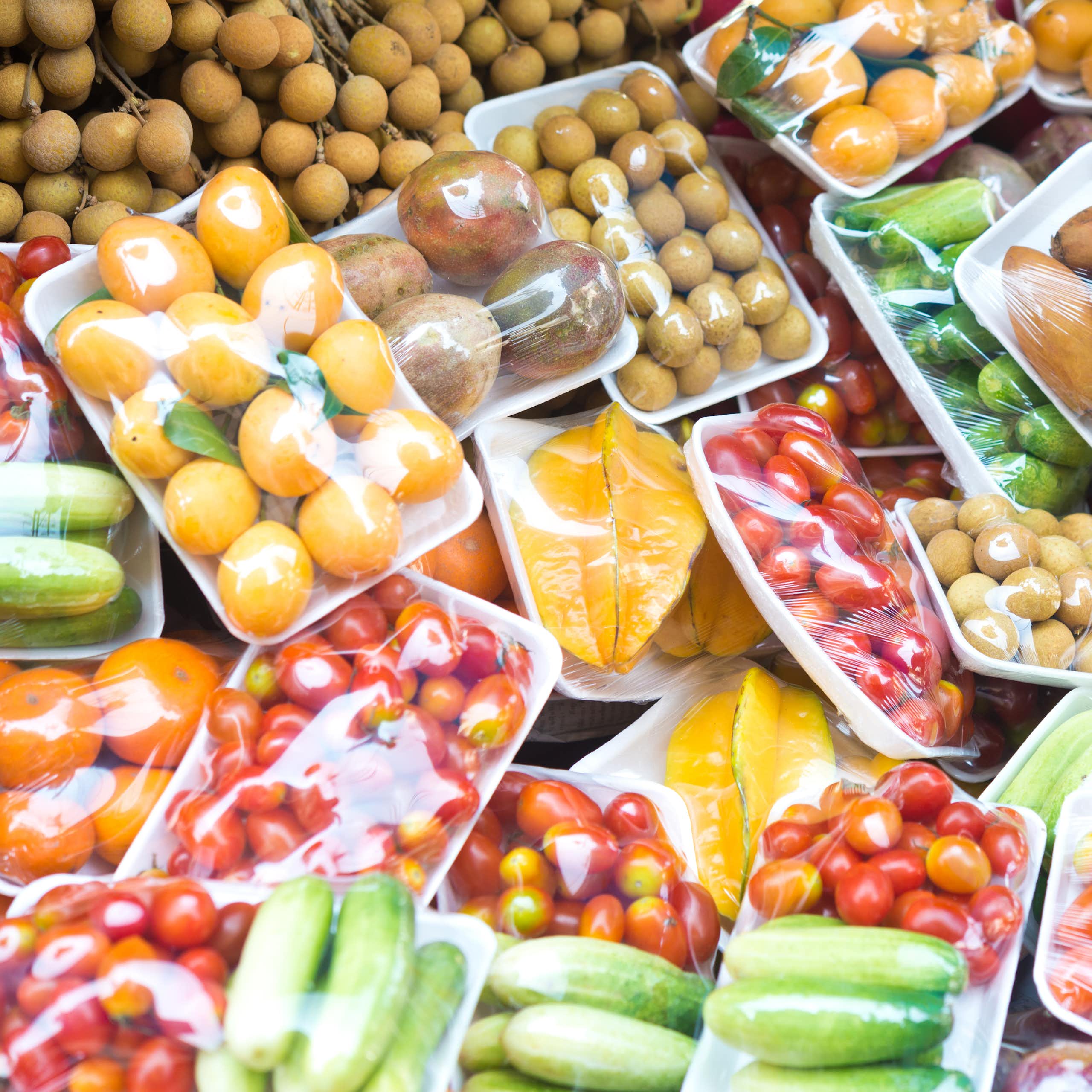 A variety of fruits and vegetables in plastic packing