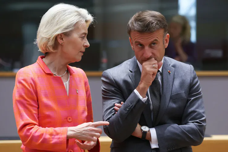Ursula Von der Leyen and Emmanuel Macron talk during an EU summit in Brussels.
