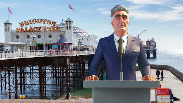 AI Steve at at a podium in front of Brighton Pier.