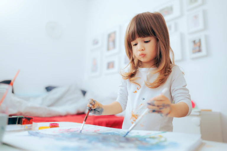 Girl painting with both hands