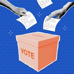 Voters submitting their votes into a ballot box.