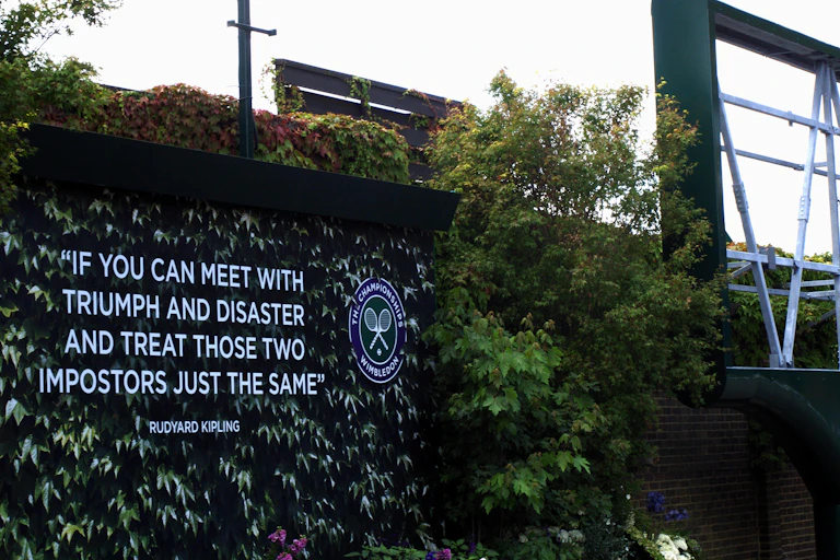 A wall mural featuring a poem by Rudyard Kipling on a wall at Wimbledon.