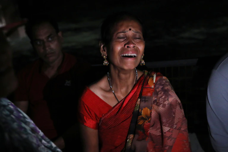 Family member of stampede victims mourn outside a hospital in Hathras, Uttar Pradesh, India