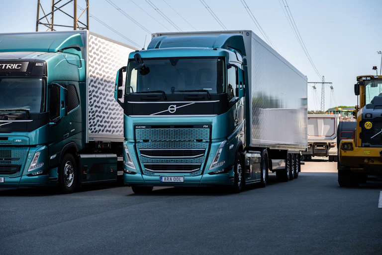Electric Volvo trucks under transmission lines