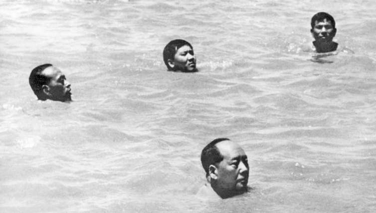 Mao in the Yangtze River surrounded by his bodyguards.