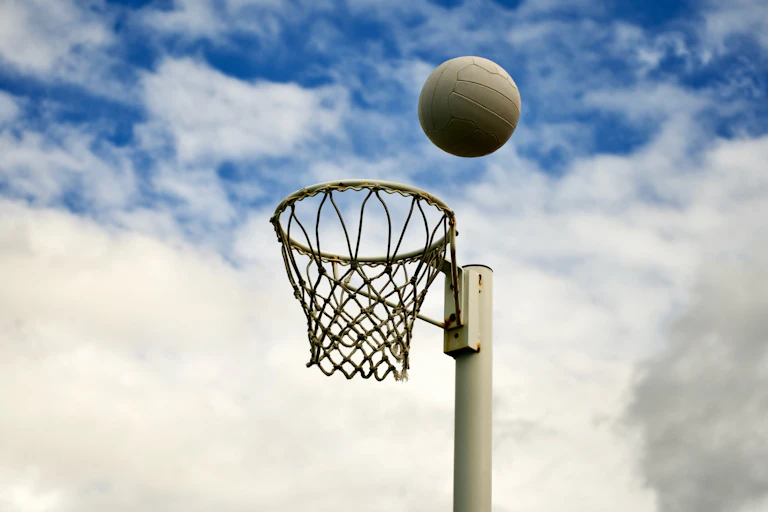 Netball about to land in goal.