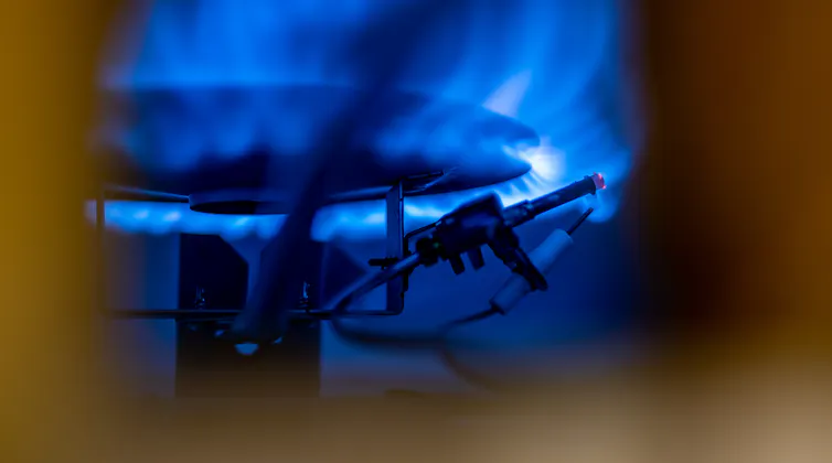 A blue pilot light in a water boiler.