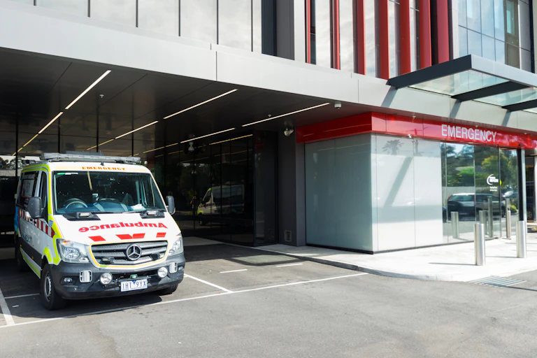 An ambulance parked outside an emergency department.