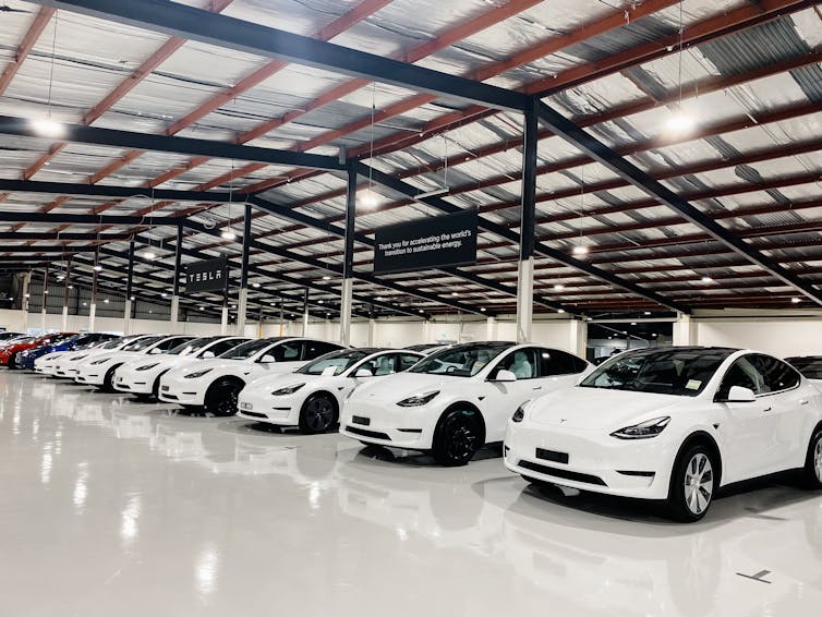 Brand new Tesla Y and 3 cars waiting to be picked up from a distribution centre.