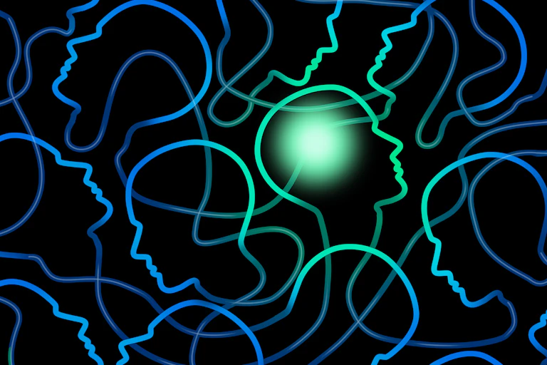 Outlines of faces in blue with one green face outline near the centre
