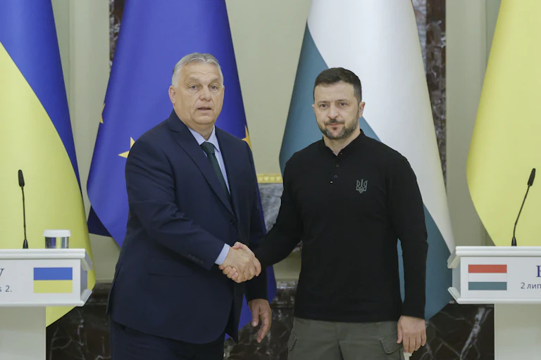 Ukraine's president, Volodymyr Zelensky, shakes hands with Hungarian prime minister, Viktor Orbán