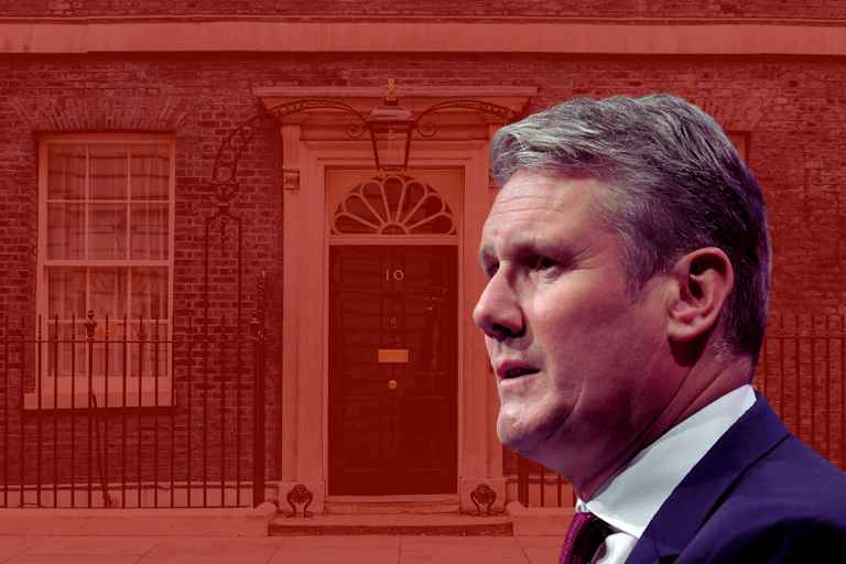 Keir Starmer with a red-tinted Downing Street behind him