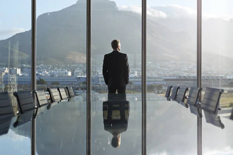 Creative Images Images Creative Editorial Video Creative Editorial Search by image or video Portrait of male CEO in big corner office, looking out of window