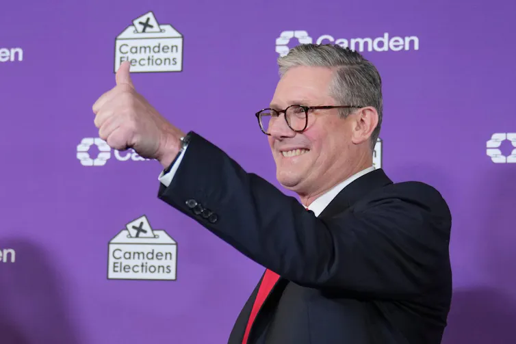 Keir Starmer gives a thumbs up to supporters after holding his seat of Holborn and St Pancras.