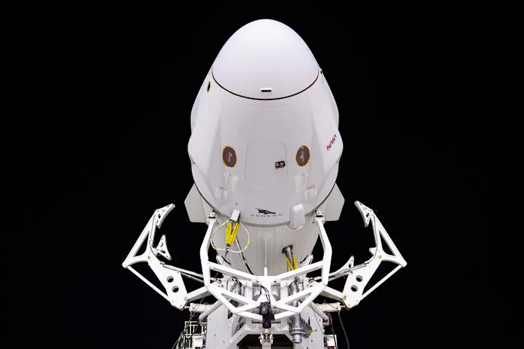 a white rockethead against a black background