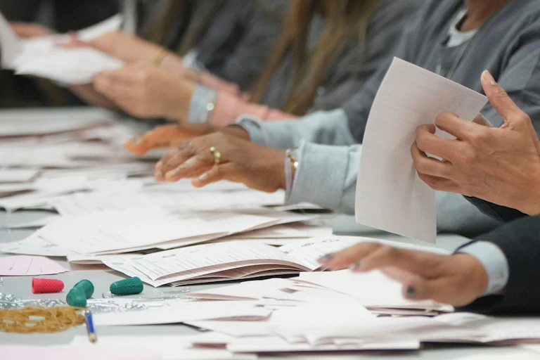 Photo of hands turning papers