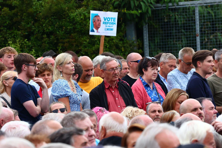A crowd of people in an audience.