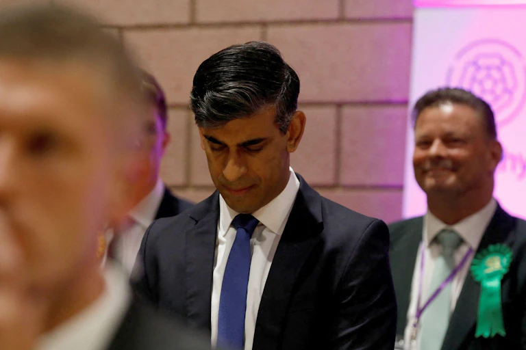 Rishi Sunak looking down whilst at a leisure centre in his constituency after holding his seat.