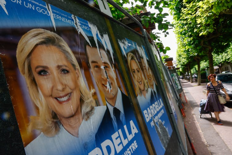 Posters showing Marine Le Pen and Jordan Bardella.