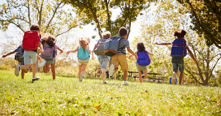 Children seen running outside.
