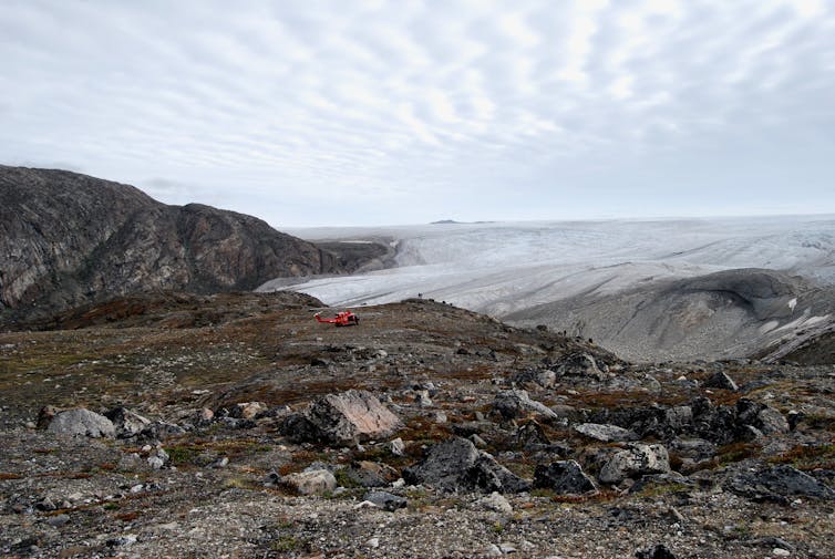 A rocky landscape with ice nearby.