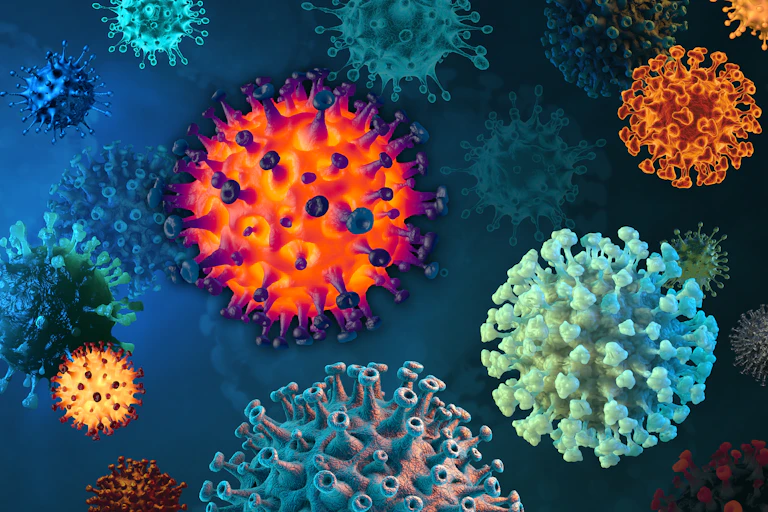An illustration of SARS-CoV-2 viruses in a range of colours.
