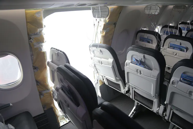Boeing plane with door plug missing after mid-air blowout