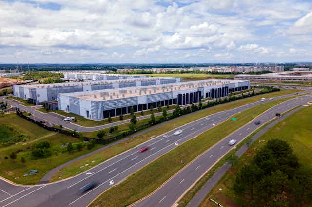 a large complex of building beside a roadway