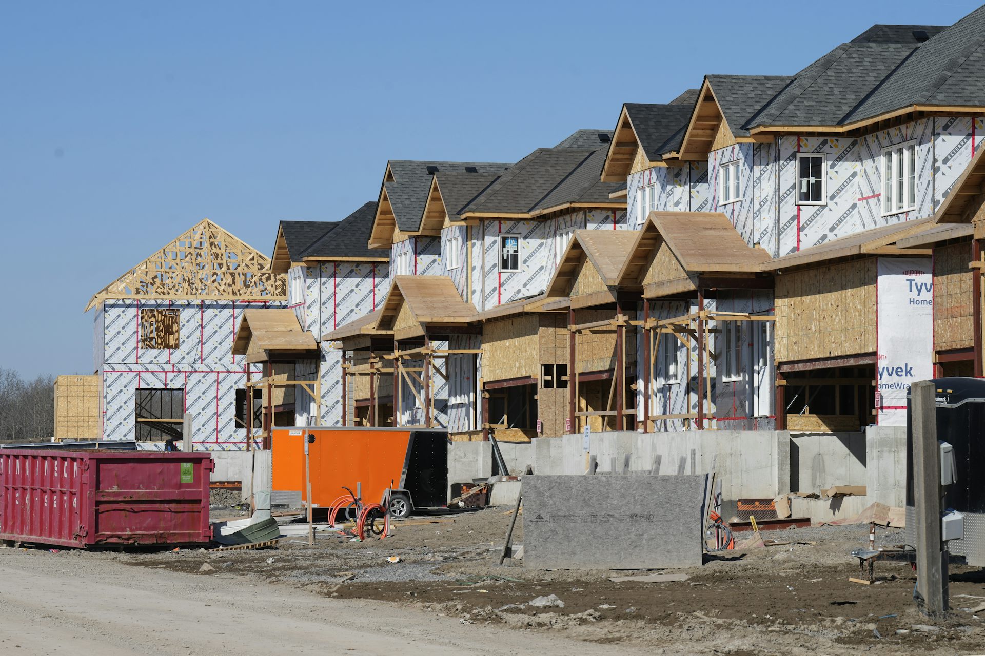 Row of half-finished houses in the process of being built