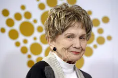A profile photo of an elderly stylish woman with short hair.