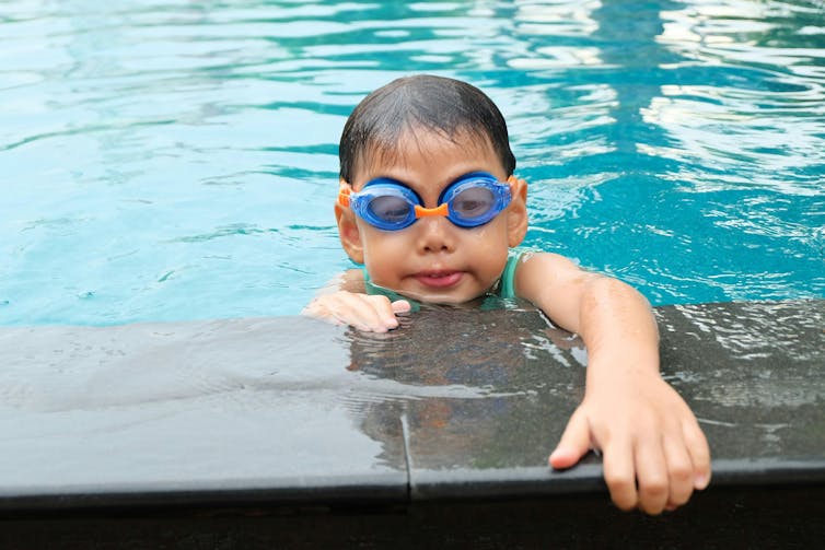 A child in a pool.