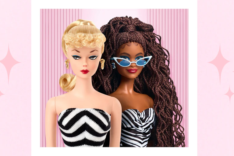 Two Barbie dolls, one black and one white