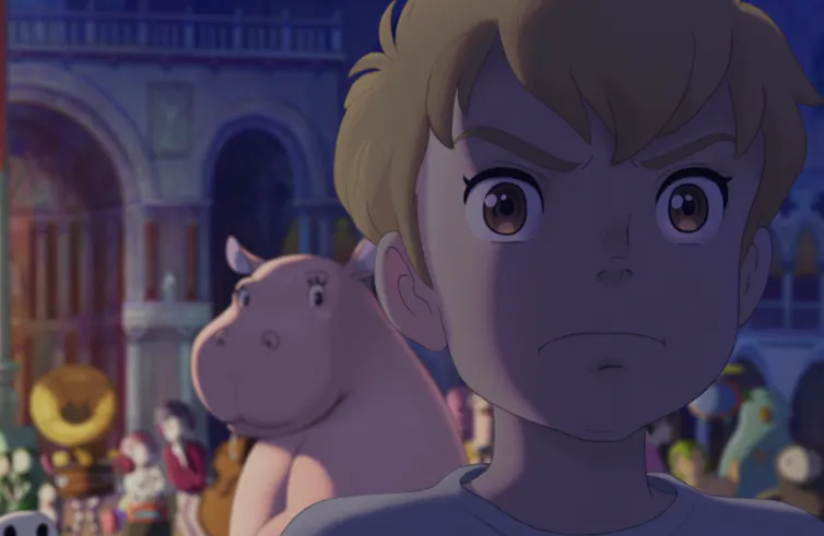A young boy and a hippo