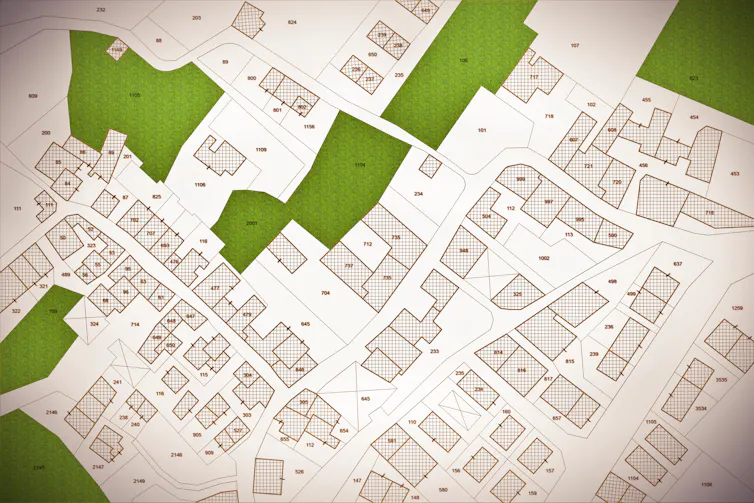 aerial map shot of houses and small patches of green land